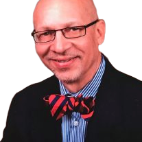 A man with glasses and a bow tie.