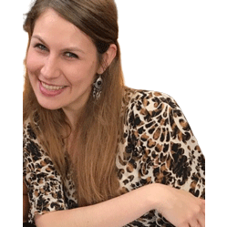 A woman in leopard print shirt smiling for the camera.